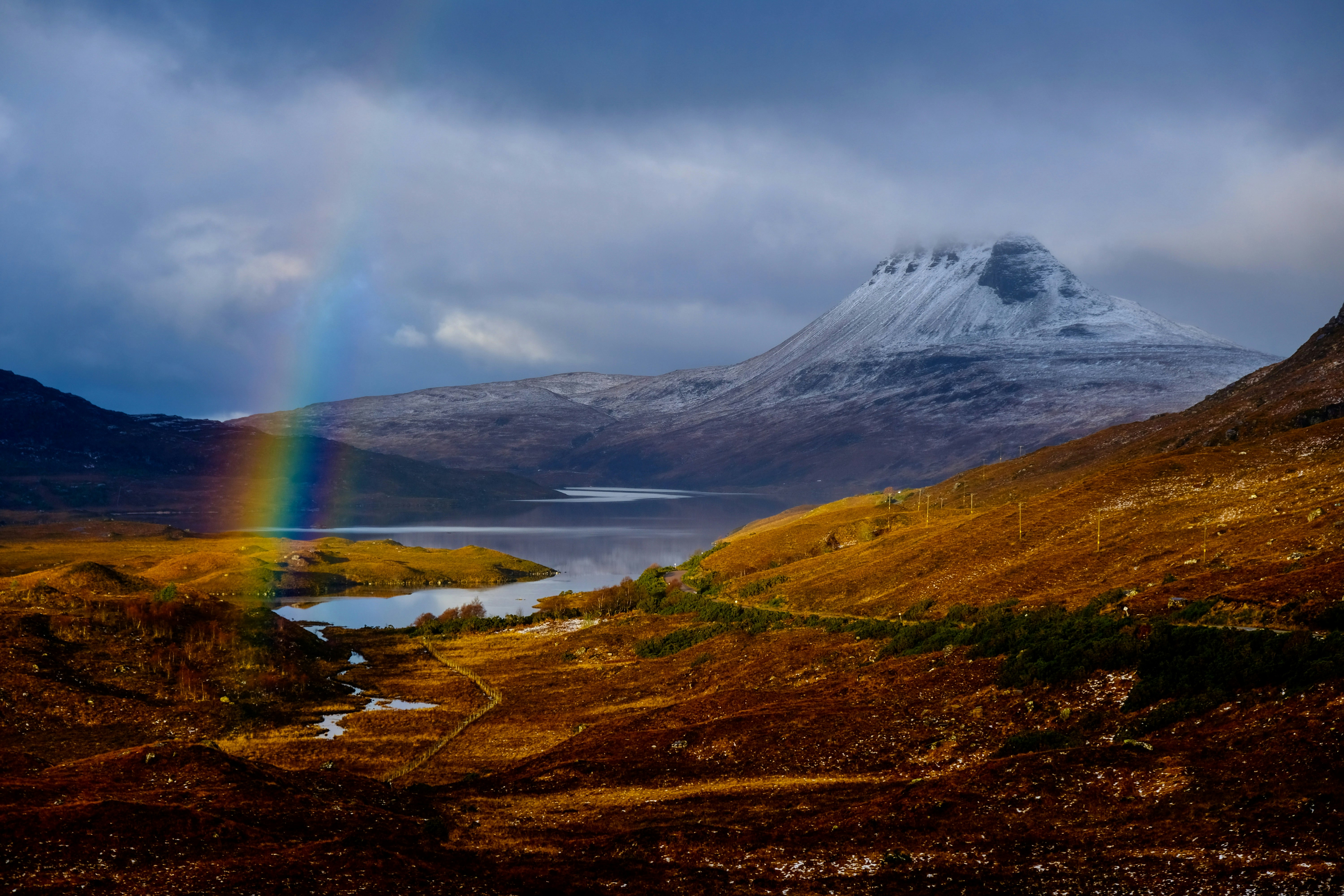 rainbow above brown field